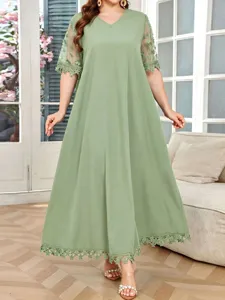 Plus size summer green V-neck dress with lace short sleeves and elegant hem design.