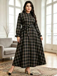 Detailed view of the vintage plaid long sleeve maxi dress featuring a waist tie and stand collar.
