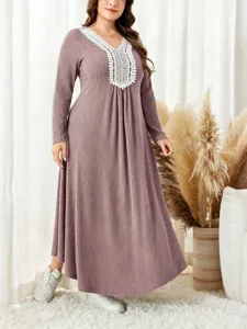 Close up view of women ribbed knit maxi dress featuring delicate white lace V-neck patchwork.
