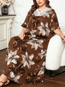 Plus size floral maxi dress with lace V-neck and ruffle sleeves for elegant summer wear.