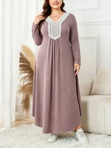 Plus size long sleeve knit dress with lace V-neck, ribbed loose casual design for autumn.