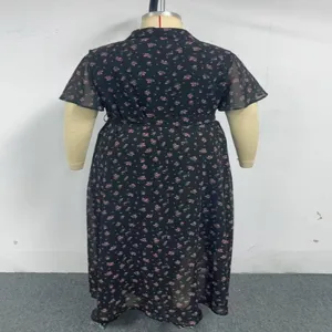 Detail view of the floral print plus-size dress back, featuring short sleeves and tie waist.