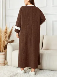Plus size knitted long robe detail showing warm winter crewneck and contrast sleeve design.