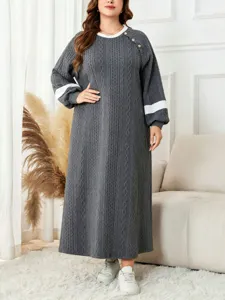Detail shot of the cozy long-sleeve knit maxi dress in grey, highlighting the contrast collar.