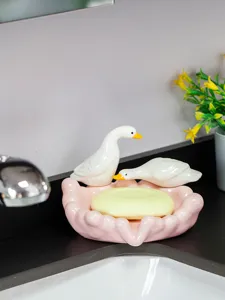Cute ceramic duck soap dish for bathroom, decorative pink soap holder tray detail.