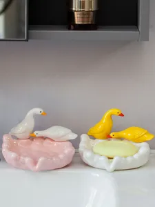 Cute ceramic duck soap dish detail view, perfect bathroom decor and creative soap holder.