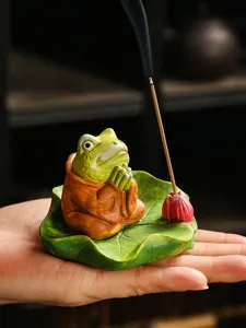 Zen frog incense burner detailed view, elegant ceramic lotus leaf holder for sticks.
