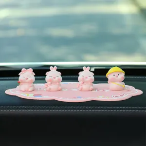 Cute pink pig car dashboard ornament set with non-slip mat, creative mini desktop decoration.