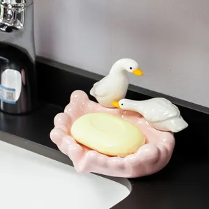 Cute ceramic duck soap dish for bathroom decor, pink seashell soap holder tray main view.