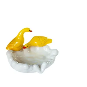 Cute ceramic duck soap dish and decorative trinket tray for bathroom and home decor.