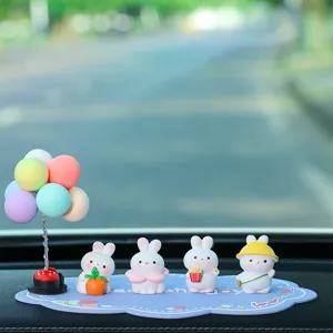 Cute cartoon rabbit car dashboard ornament set with colorful balloons and anti-slip mat.