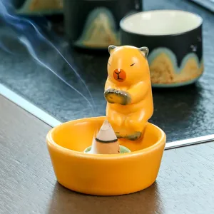 Ceramic cute animal incense burner with yellow bowl for home aromatherapy and desktop decor.