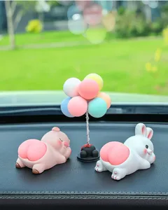 Cute car dashboard ornament set with cartoon pig rabbit and colorful balloon tree decor.