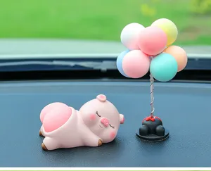 Cute pig and balloon tree car dashboard ornament, sweet resin interior decor accessory for women.