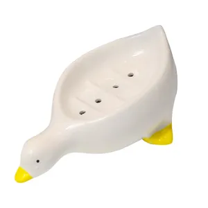 Porte-savon mignon en céramique en forme de canard pour salle de bain, avec trous de drainage.