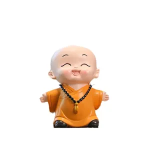 Cute little monk figurine for office desk and home decor, resin healing tabletop ornament.