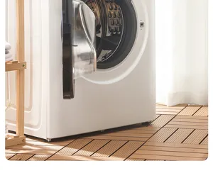 Front load washing machine lifestyle scene on wooden floor for modern home laundry room decor.