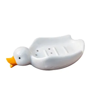 Porte-savon canard en céramique mimi avec trous de drainage pour décor de salle de bains.