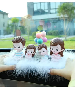 Cute family cartoon dolls car ornament with white feather base for auto interior decor