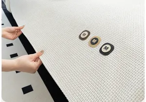 Close-up detail of a white waffle chenille sofa cushion cover showing fabric texture.