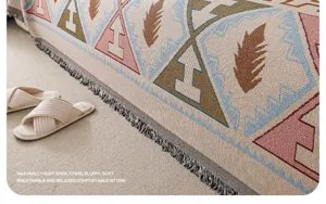 Detail view of retro chenille sofa towel, woven tribal pattern blanket with elegant fringe decor.