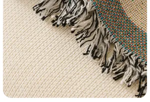 Close-up detail shot of vintage chenille sofa blanket texture with woven colorful fringe tassels.
