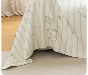 Ice silk sofa cover detail, green white vertical stripes and cute cartoon bear pattern.