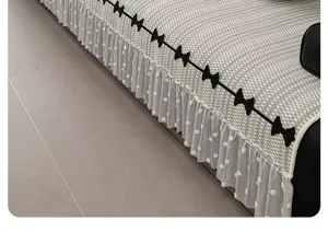 Detail shot of ice silk sofa cushion cover with black bows and white polka dot mesh skirt trim.