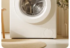 Detailed view of white front load washing machine in a warm modern interior home scene.