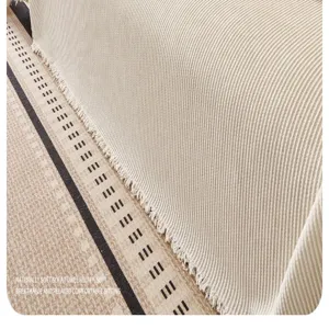 Chenille sofa towel detail shot showing soft ribbed texture and elegant fringe edge design.
