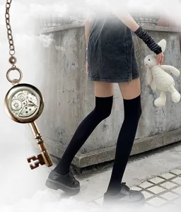 Vintage key pocket watch with mechanical gear dial and long over-the-knee socks detail.