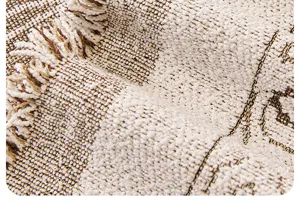 Chenille sofa blanket fabric detail close-up with elegant fringe and woven texture