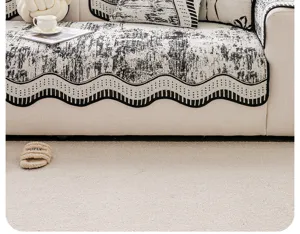 Moderno copridivano con motivo astratto in bianco e nero e bordo ondulato elegante per soggiorno