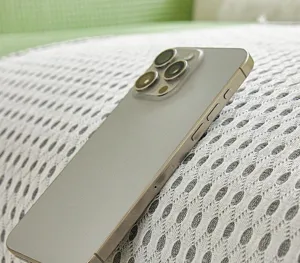 Detailed view of the ice silk waffle sofa cushion fabric texture with a phone display.