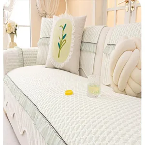 Cozy cream chenille sofa cushion detail showcasing soft texture and elegant ruffled edge design.