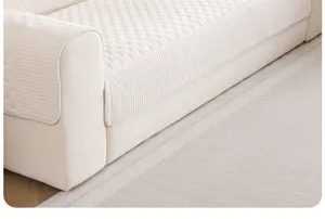 Close-up detail of beige corduroy sofa cushion, textured geometric pattern, non-slip design.