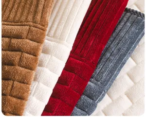 Close-up detail of soft corduroy sofa cushion texture, showing premium multi-color fabric lines.