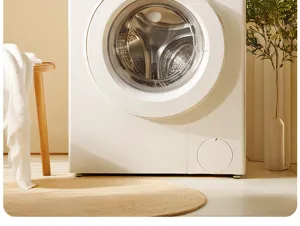 Modern white washing machine detail view in a cozy laundry room setup with warm tone aesthetic.