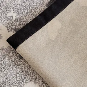 Non-slip sofa cushion backing detail showcasing textured dot matrix and black edge trim.