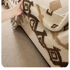 Close-up detail shot of plush sofa cover fabric, showing soft textured geometric pattern clearly.