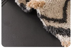 Close-up detail of retro chenille sofa cover blanket with textured woven geometric pattern.