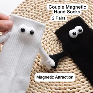Fun magnetic holding hands couple socks with 3D googly eyes, black and white mid tube cotton socks.