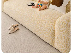 Jacquard velvet sofa slipcover detail, full-wrap stretch fabric, warm yellow geometric pattern.