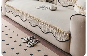 Ice silk sofa cushion cover with fringe and wavy trim, modern minimalist home decor style, beige.