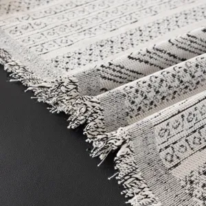 Bohemian sofa cover blanket with black and white geometric pattern and tassels for all seasons.