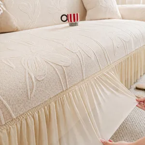 Universal stretch jacquard sofa cover with elegant lace skirt trim, all-inclusive fit.