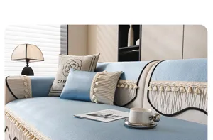 Ice silk sofa cushion detail, elegant blue and beige design with delicate tassel trim.