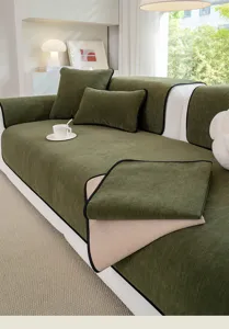 Detail view of green chenille sofa cushion cover, showing soft fabric texture and decor.