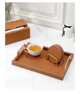 Brown leather coasters set with metal holder and serving tray for coffee table home decor.