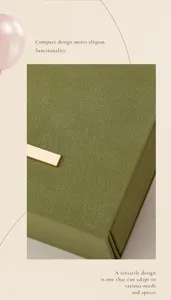 Compact green leather jewelry box, elegant portable travel organizer for rings and small earrings.